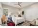 Cozy bedroom with a queen bed, wood floors, a window, and natural light at 2105 Loblolly Ln, Seabrook Island, SC 29455