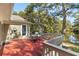 Outdoor deck area featuring a table with chairs and built-in seating, perfect for enjoying the peaceful waterfront view at 2105 Loblolly Ln, Seabrook Island, SC 29455