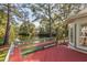 Outdoor deck area showcasing a tranquil water view, wooden railing, and integrated bench seating at 2105 Loblolly Ln, Seabrook Island, SC 29455