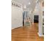 Bright hallway with hardwood floors and decorative columns leading into a living area at 2105 Loblolly Ln, Seabrook Island, SC 29455