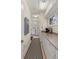 Hallway featuring a countertop, cabinets, and a view into the laundry room with washer and dryer at 2105 Loblolly Ln, Seabrook Island, SC 29455