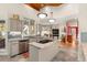 Modern kitchen featuring stone countertops, stainless steel appliances, and an island cooktop at 2105 Loblolly Ln, Seabrook Island, SC 29455