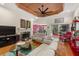 Bright living room with hardwood floors, modern furniture, fireplace, and access to a patio area at 2105 Loblolly Ln, Seabrook Island, SC 29455