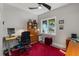 Comfortable home office with a large window, wood floors, and a built-in bookcase at 2105 Loblolly Ln, Seabrook Island, SC 29455