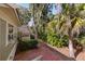 A lovely brick patio area with access to the home and overlooking a natural, wooded area at 2105 Loblolly Ln, Seabrook Island, SC 29455