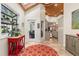Bright sunroom with skylights, tiled floors, a view into the kitchen, and access to the outside at 2105 Loblolly Ln, Seabrook Island, SC 29455