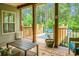 Cozy back porch overlooking the pool and the forest at 222 Sinclair Rd, Summerville, SC 29483