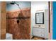 Modern bathroom showcasing tiled shower and vanity with granite countertop and framed mirror at 222 Sinclair Rd, Summerville, SC 29483