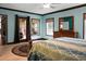 Bright bedroom featuring a ceiling fan, light-colored walls, and outdoor access to a patio at 222 Sinclair Rd, Summerville, SC 29483
