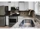 Modern kitchen featuring stainless steel appliances and granite countertops at 222 Sinclair Rd, Summerville, SC 29483