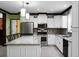 Bright kitchen with white cabinets, granite countertops, and stainless steel appliances at 222 Sinclair Rd, Summerville, SC 29483