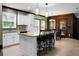 Open kitchen featuring an island with barstools, stainless steel appliances, and dining area at 222 Sinclair Rd, Summerville, SC 29483