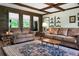 Spacious living room with wood accents, comfortable sofas, and a decorative rug at 222 Sinclair Rd, Summerville, SC 29483