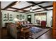 Cozy living room with wood-beamed ceiling, comfortable seating, and a large window at 222 Sinclair Rd, Summerville, SC 29483