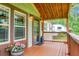 Inviting front porch with wooden accents, cozy seating, and decorative touches at 222 Sinclair Rd, Summerville, SC 29483