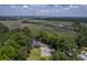 Overhead view of a home in a wooded area with marsh views nearby at 2340 Ashley River Rd, Charleston, SC 29414