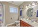 This bathroom features a vanity with a marble countertop and tile flooring at 2340 Ashley River Rd, Charleston, SC 29414