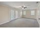 This bedroom has carpeted floors and a set of walk-out french doors at 2340 Ashley River Rd, Charleston, SC 29414