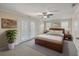 This bedroom features a ceiling fan, hardwood floors, and a walk-out balcony at 2340 Ashley River Rd, Charleston, SC 29414