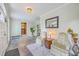 Inviting foyer features slate floors, comfortable seating, and views into the dining room at 2340 Ashley River Rd, Charleston, SC 29414