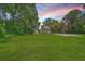 Classic brick home on a large lot featuring a well-manicured green lawn at 2340 Ashley River Rd, Charleston, SC 29414