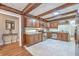 Cozy kitchen featuring wood cabinets, stainless appliances, and a view into the breakfast area at 2340 Ashley River Rd, Charleston, SC 29414