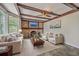 Inviting living room with brick fireplace, wood beams, and slate flooring at 2340 Ashley River Rd, Charleston, SC 29414