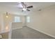 This lofted area is carpeted and features two windows and a ceiling fan at 2340 Ashley River Rd, Charleston, SC 29414