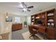 This lofted home office features custom wood shelving and carpeted floors at 2340 Ashley River Rd, Charleston, SC 29414
