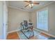 This home office features hardwood floors, natural light, and a ceiling fan at 2340 Ashley River Rd, Charleston, SC 29414