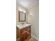 This powder room features tile flooring and a dark wood vanity at 2340 Ashley River Rd, Charleston, SC 29414