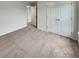 This bedroom features a light colored carpet and a double-door closet at 242 Daniels Creek Cir, Goose Creek, SC 29445