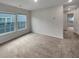 Carpeted room with plenty of natural light, two large windows and a closet at 242 Daniels Creek Cir, Goose Creek, SC 29445