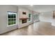 Bright, open-concept living room with fireplace and access to outdoor patio at 242 Daniels Creek Cir, Goose Creek, SC 29445