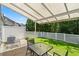 Enjoy this backyard with fenced in yard and covered patio at 2488 Stadium Dr, North Charleston, SC 29406
