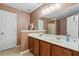 Bathroom features a dual sink vanity and a large mirror at 2488 Stadium Dr, North Charleston, SC 29406