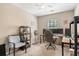 This bedroom features a ceiling fan, desk, shelves, and neutral walls at 2488 Stadium Dr, North Charleston, SC 29406