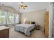 This bedroom features a ceiling fan, large windows, and neutral walls at 2488 Stadium Dr, North Charleston, SC 29406