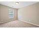 This bedroom features a large window and neutral walls at 2488 Stadium Dr, North Charleston, SC 29406