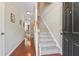 Home entryway with hardwood floors and stairway leading to the upper level at 2488 Stadium Dr, North Charleston, SC 29406
