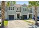 Exterior view of townhomes with well manicured lawns at 2488 Stadium Dr, North Charleston, SC 29406