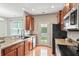 Well-equipped kitchen with stainless steel appliances and hardwood floors at 2488 Stadium Dr, North Charleston, SC 29406