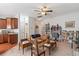 Cozy living room with plush carpet, ceiling fan, and natural light with a kitchenette area at 2488 Stadium Dr, North Charleston, SC 29406
