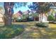 Charming brick home with a well-manicured lawn, mature trees, and a two-car garage at 2707 Waterpointe Circle Cir, Mount Pleasant, SC 29466