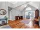Bright living room with vaulted ceilings, hardwood floors, French doors, and neutral tones at 2707 Waterpointe Circle Cir, Mount Pleasant, SC 29466