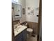 Bathroom vanity with a white sink, blue cabinets and mosaic tile backsplash at 277 Carolina Cir, Walterboro, SC 29488