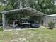 Metal carport with a boat on a trailer, a UTV and a car stored inside at 277 Carolina Cir, Walterboro, SC 29488