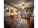 Comfortable living room featuring two sofas, a ceiling fan, wood floors, a decorative rug, and charming wall decor at 277 Carolina Cir, Walterboro, SC 29488