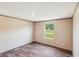 Cozy bedroom with hardwood floors, natural light, and neutral wall color for a relaxing ambiance at 282 Marion Rd, Dorchester, SC 29437