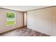 Well-lit bedroom with hardwood floors, a large window, and a neutral color scheme for versatile decor at 282 Marion Rd, Dorchester, SC 29437